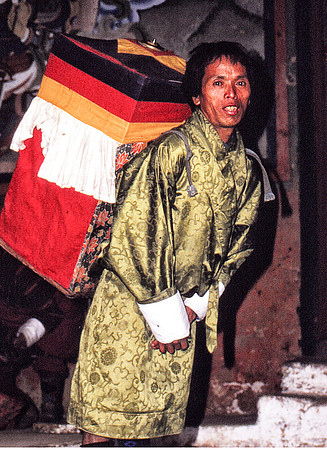 A Bhutanese Holiman with mobil Budhist Shrine