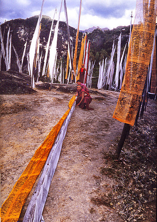 Placing Prayer Flags below Tak San