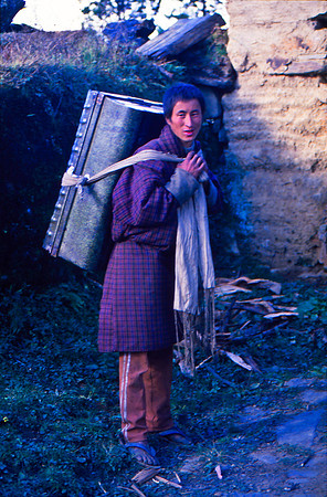 Bhutanes Man Carrying a Portable Shrine