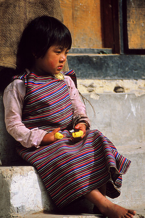 Young Butanese Girl with a Toy
