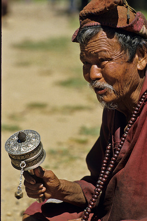 Mong Twirling a Prayer Wheel- Wangdi Podrung Dzong