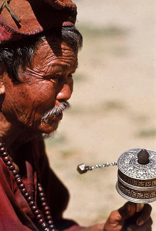 An Old Lama Twirlng a Prayer Wheel, Wandipodrun