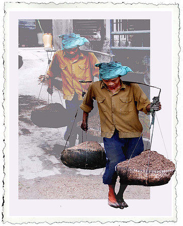 A CARTER IN VIETNAM POTTERY VILLAGE