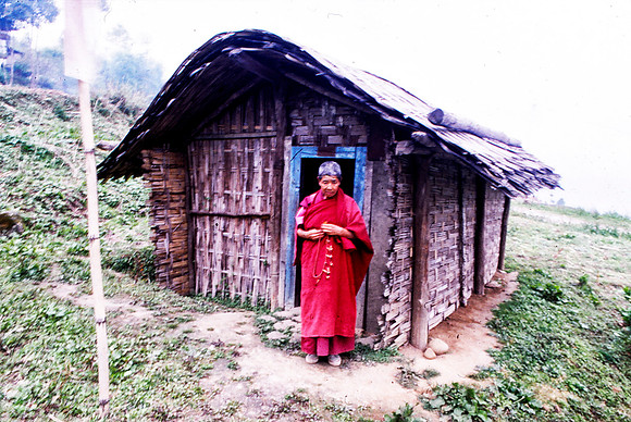 Old Bhutnese Women with Pray Beds in Her Mountain Home