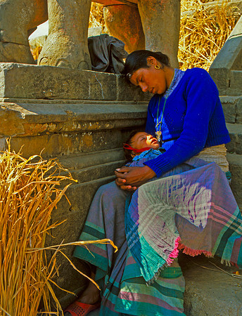 Mother Resting with Child on Statue, Katmandu