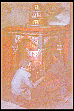 YOUNG AND OLD TURNING OF THE PRAYER WHEEL - TAK SAN, BUHTAN-2